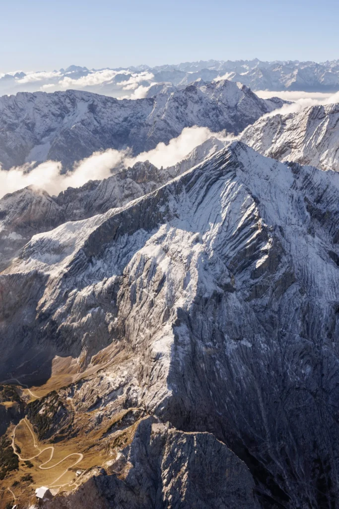 Snow-covered Alpine peaks from above near Bavaria and Austria