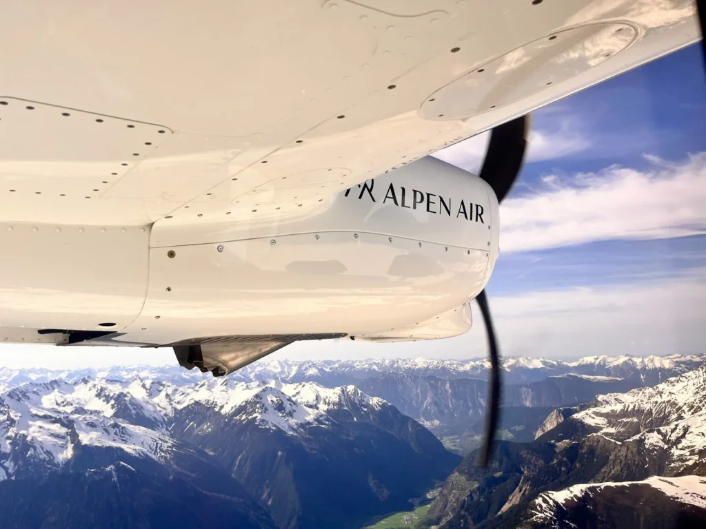 Scenic Flight over Munich with ALPEN AIR aircraft above snow-covered Alps