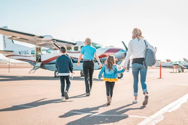 Family walking toward an aircraft