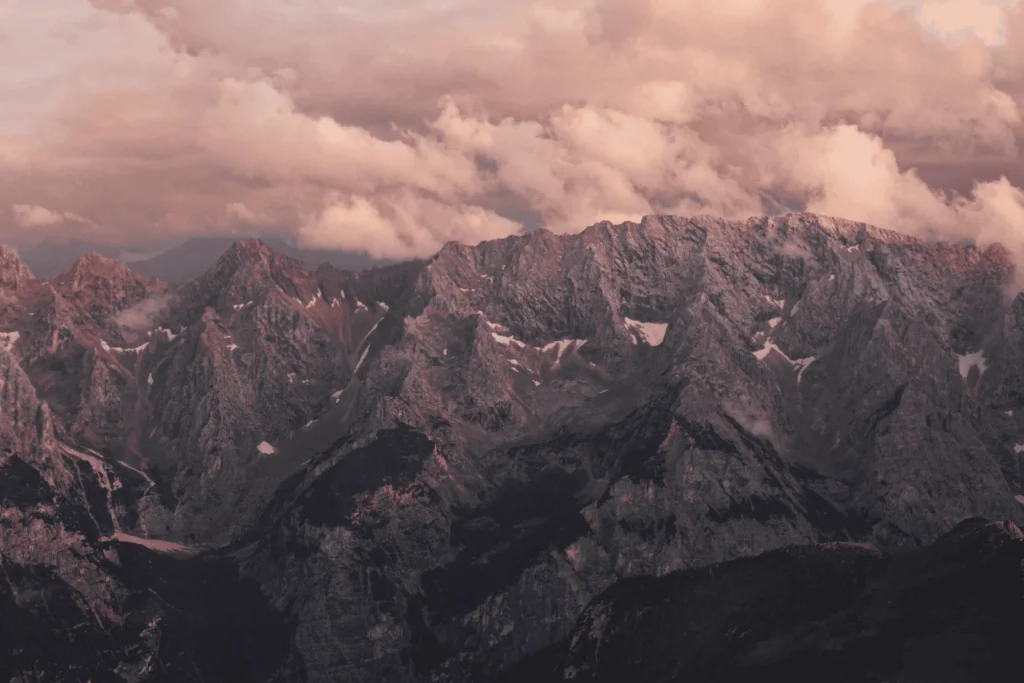 Alpine mountain panorama with clouds during a sightseeing flight in Bavaria