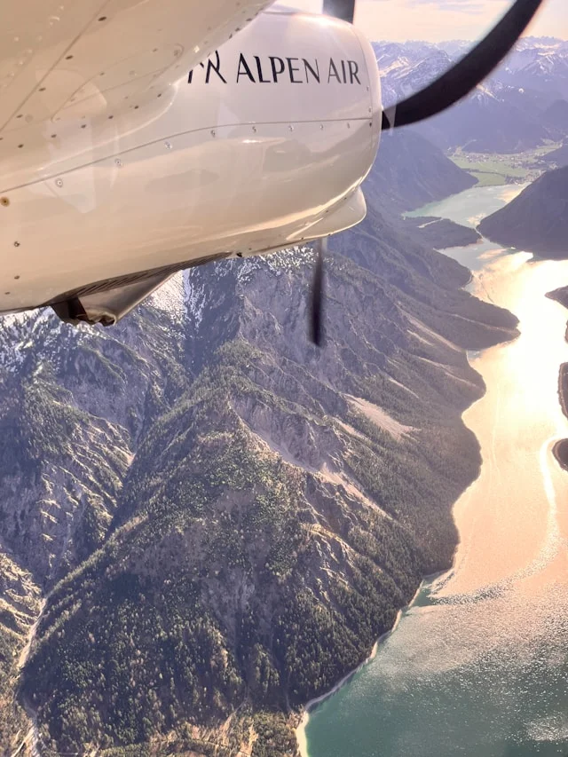 Marriage Proposal Neuschwanstein with ALPEN AIR flight over Alps lake and warm light